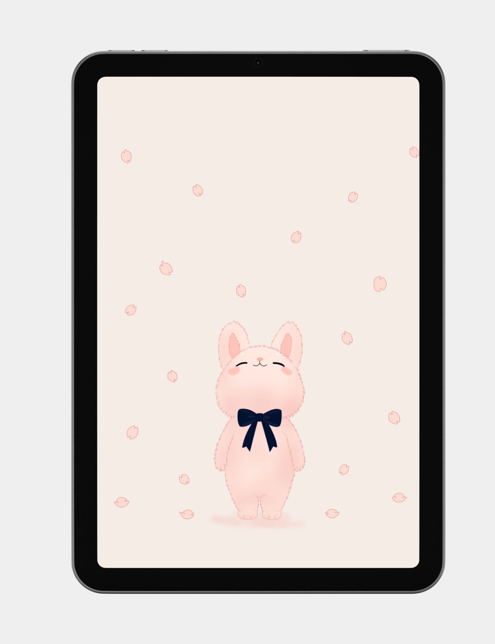 Cute pastel bunny tablet wallpaper with cherry blossom petals, navy ribbon, and soft blush background.